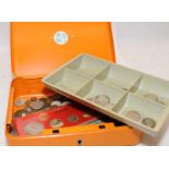 Metal cash box containing a collection of coins and notes including some silver