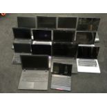 A Crate of various laptops.