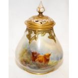 Antique Royal Worcester blush ivory vase with pierced lid featuring gilded accents decorated with