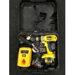 Dewalt drill with battery and charger in case.