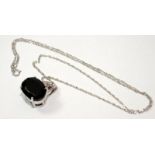 A large black gemstone w/g on 925 silver pendant.