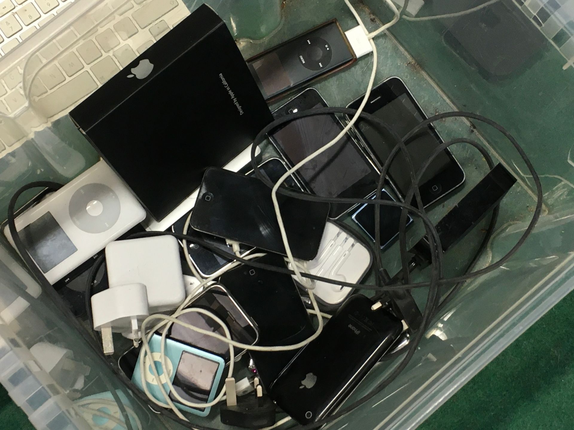 A box of various Apple products including iPad, iPhones and Apple TV boxes. - Image 2 of 2