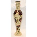 Moorcroft tall narrow baluster vase in the chocolate Cosmos pattern. Standing 31cms tall.