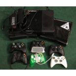 Three Xbox 360 consoles c/w controllers and some cables.