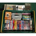 A crate contains various dvd/box sets to include Mash, laurel and hardy, Auf Wiedershen.