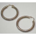Large sterling silver rope designed hoop earrings.