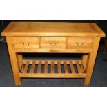 Quality light oak dresser base, three drawers over pot board. 118cms wide x 85cms x 40cms.