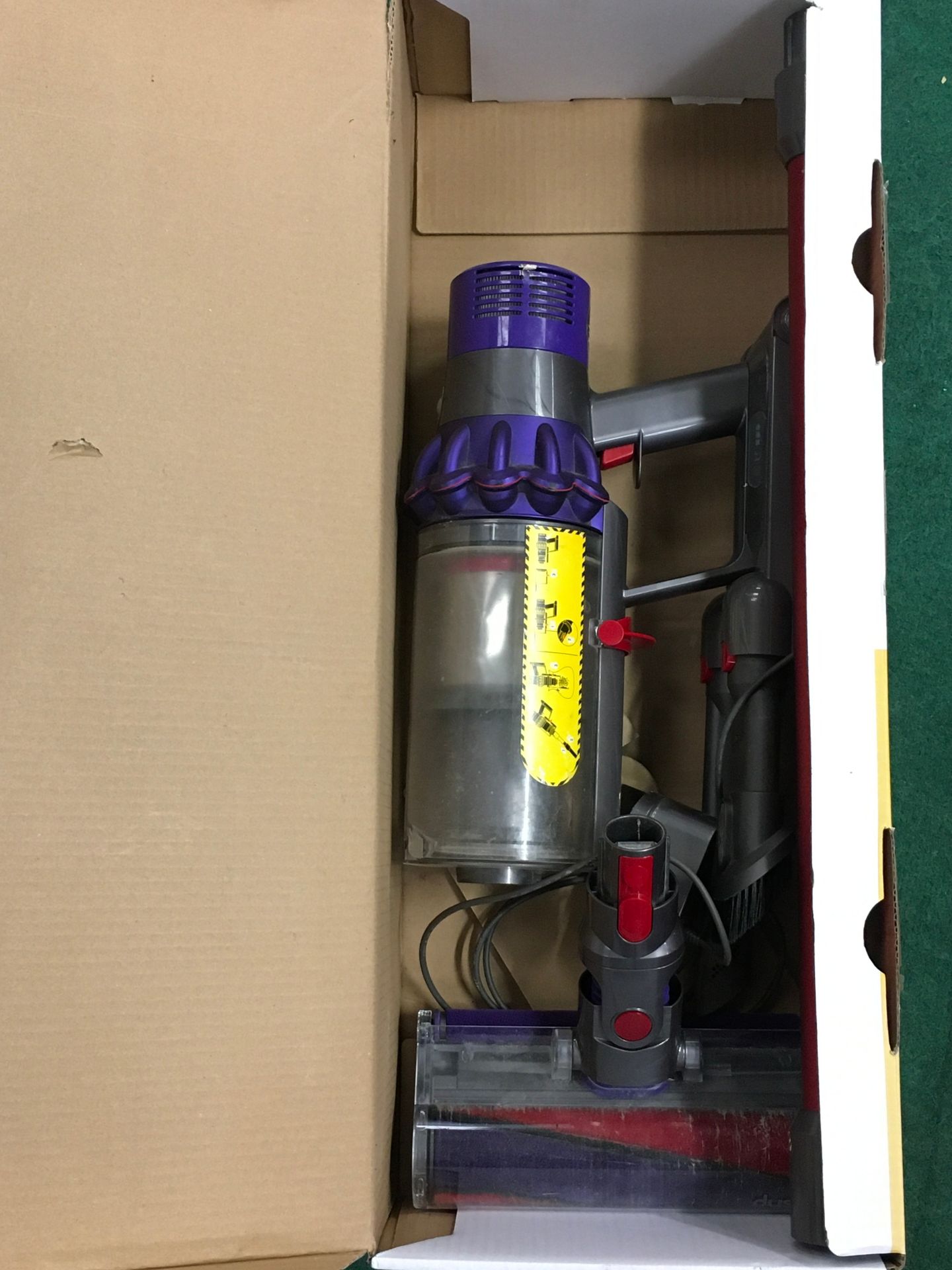 A Dyson vacuum cleaner in box.