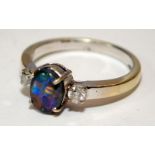 An opal approx 1.50ct gold ring wit two diamonds on side 5.3g Size v
