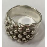A silver five bar keeper ring, Size Z6. (POCA 48)