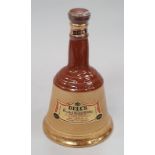 Bells Wade porcelain whisky decanter sealed 75cl.