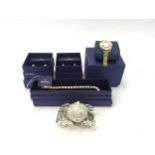 A crystal carriage together with three boxed Swarovski jewellery items (H25, H26, H27, 71).