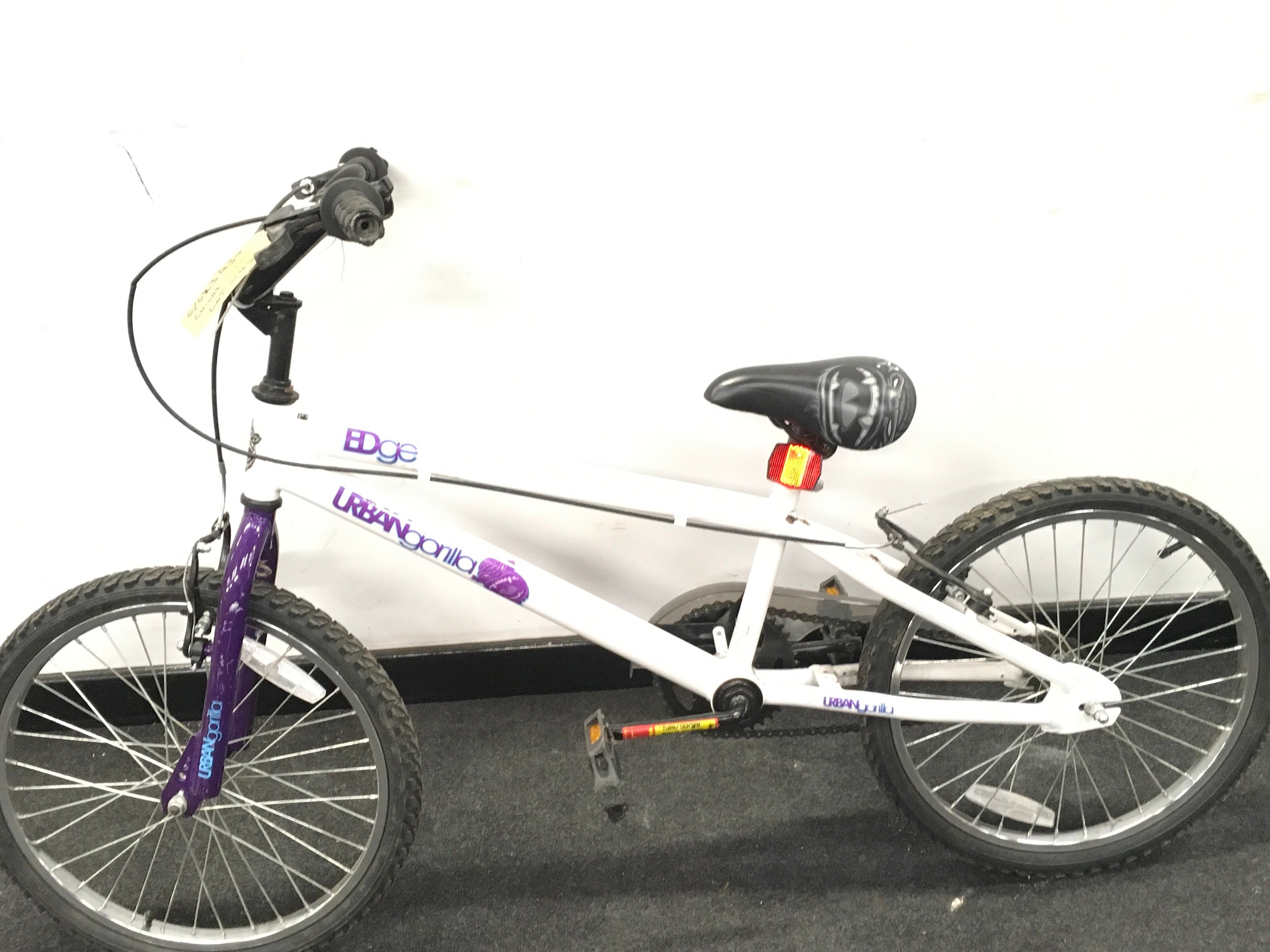 A white and purple child's bike (45)
