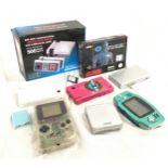 A collection of hand held video game consoles to include Nintendo.