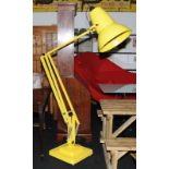 A yellow Giant angle-poise lamp 1227.