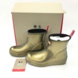 A pair of gold Hunter ankle wellington boots size UK 5.