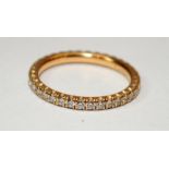 A Cartier ladies 18ct gold & diamond eternity ring size H. (15)