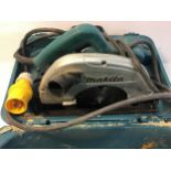 Makita 5704RX circular Saw in case.