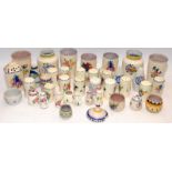 Large collection of Poole Pottery salt and pepper pots in the traditional patterns c/w other small
