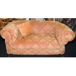 Vintage low back drop end sofa on castors in red/gold upholstery with matching cushion. Approx