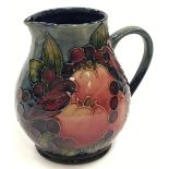 Moorcroft Finches & Fruit pattern jug of slightly bulbous form. 14.5cm tall. Signed and stamped to