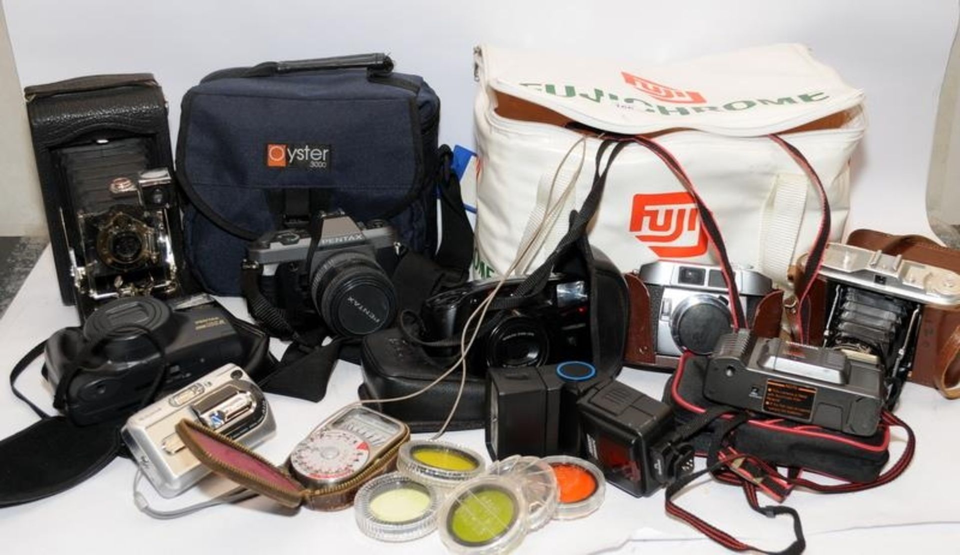 Collection of vintage cameras to include Pentax P30 and Zoom 105, a Kodak fold out camera and an