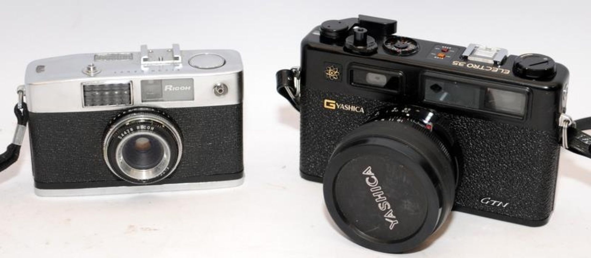 2 x vintage 35mm cameras to include Yashica Electro 35 rangefinder and a Ricoh Caddy