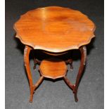 Edwardian mahogany occasional table on slender curved legs with a small under shelf. 70cms tall