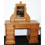Solid pine kneehole dressing table with a total of nine drawers c/w dressing table mirror with an