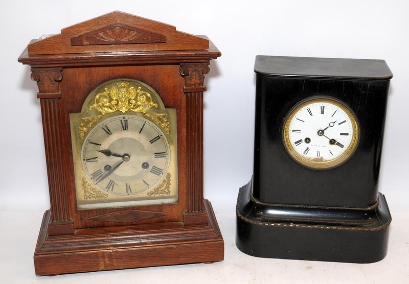 Two Antique mantel clocks to include a 19th century black painted French example. Untested