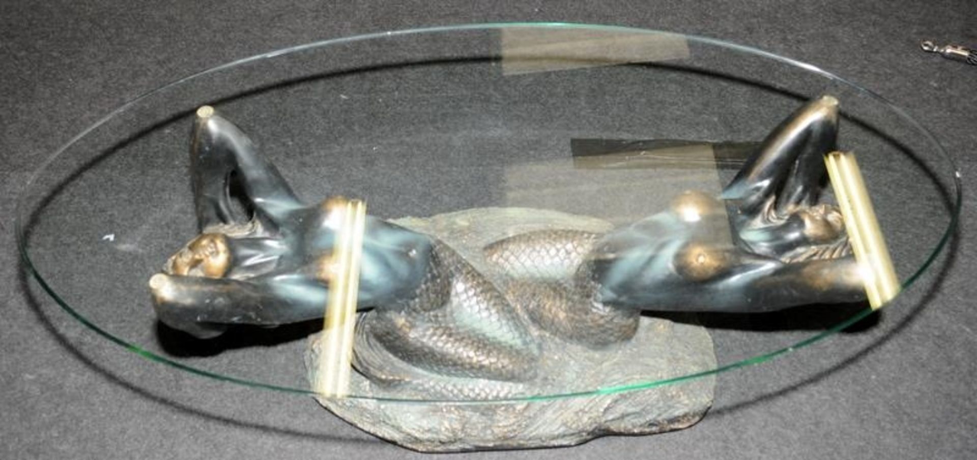 Large glass topped oval coffee table featuring a bronzed resin base depicting mermaids 44cms tall - Image 3 of 4