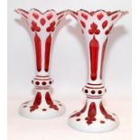 Pair of antique Bohemian overlay glass vases of flared trumpet form. 27cms tall