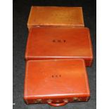 Three pieces of vintage leather luggage to include two 'Victor' red leather pieces