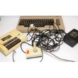 Vintage Commodore 64 home computer c/w joystick, tape recorder (a/f) and mains/data cable. Untested