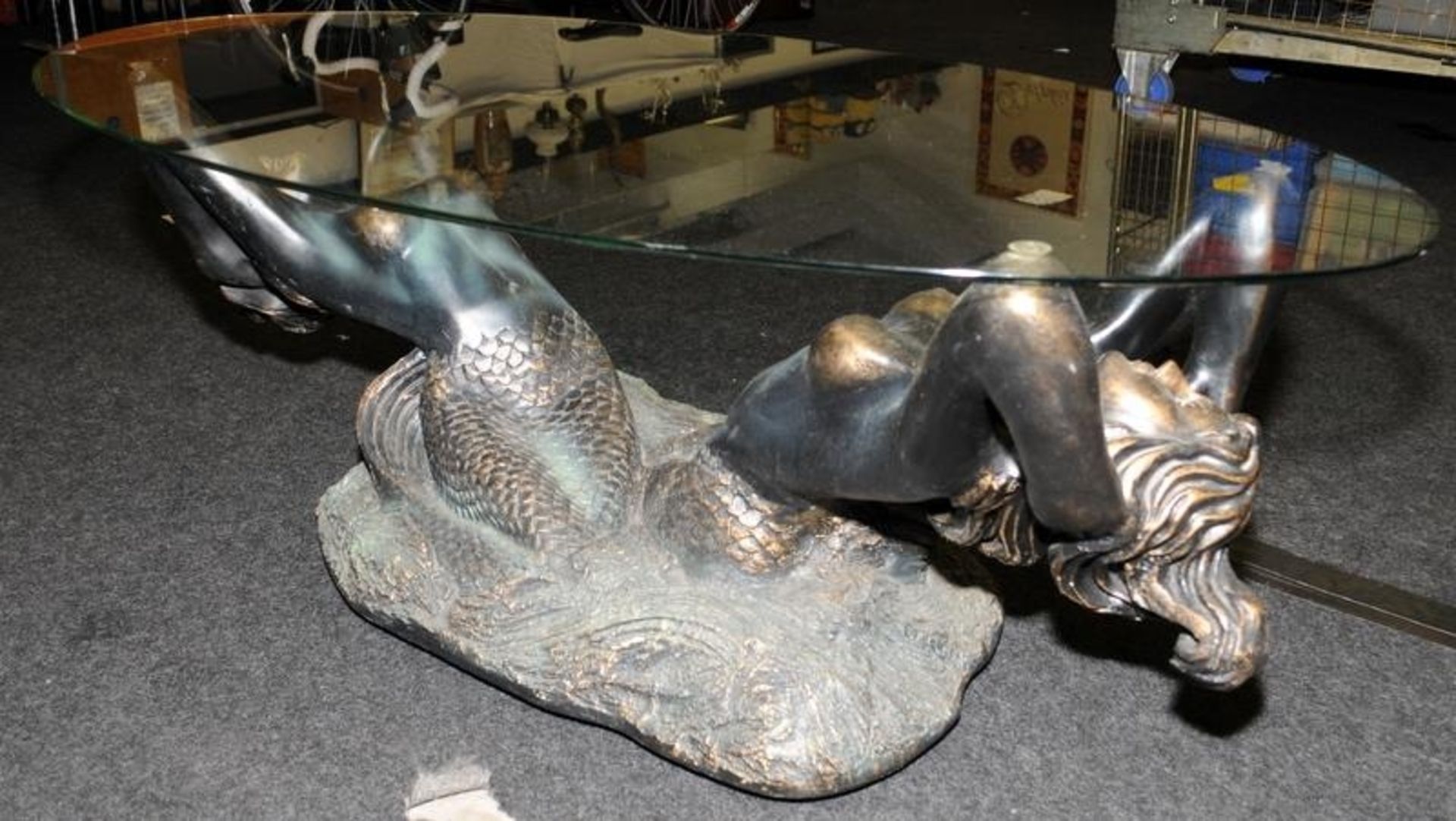 Large glass topped oval coffee table featuring a bronzed resin base depicting mermaids 44cms tall - Image 4 of 4