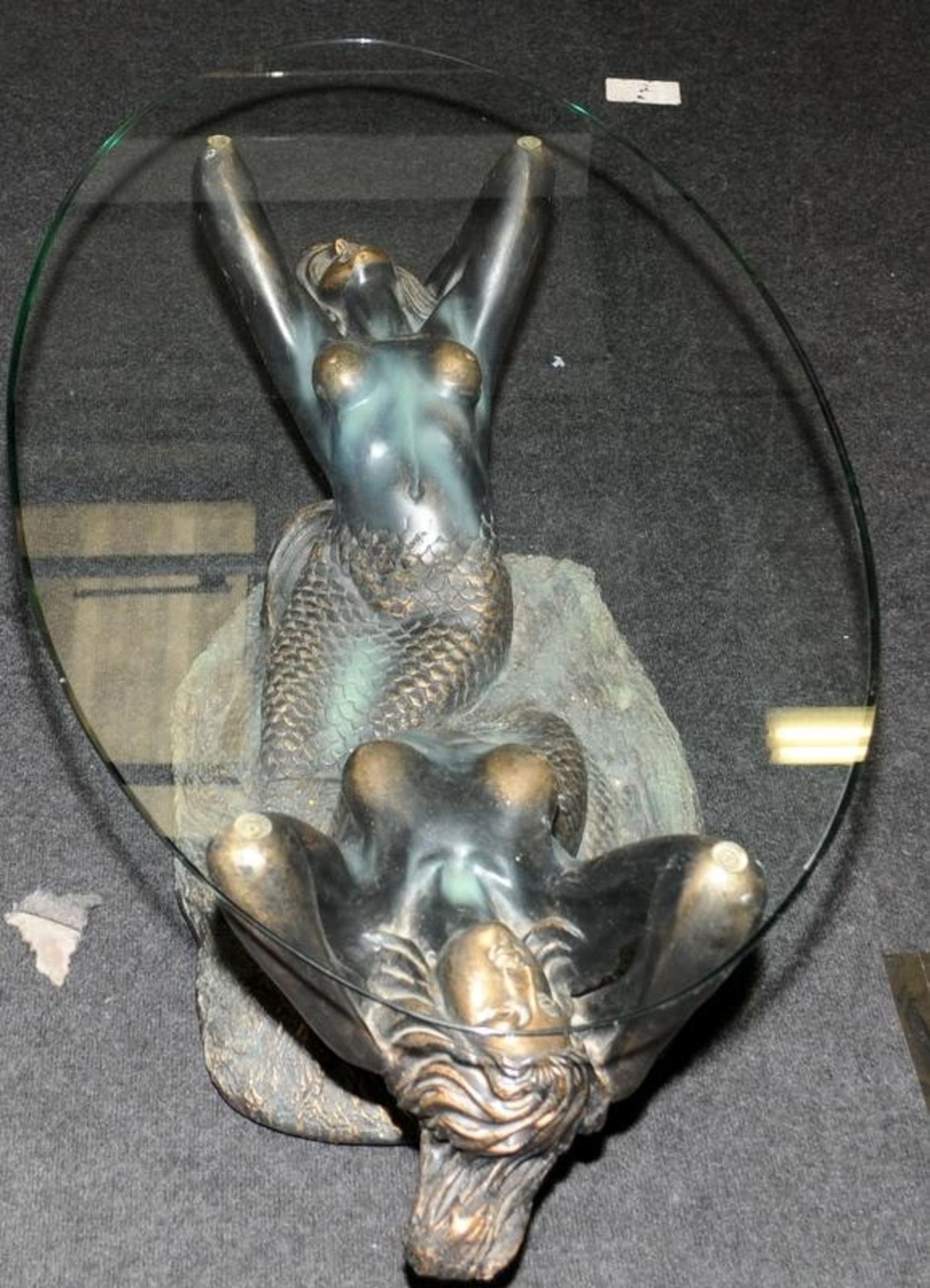 Large glass topped oval coffee table featuring a bronzed resin base depicting mermaids 44cms tall - Image 2 of 4