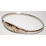 A Mother of pearl 925 silver bangle.