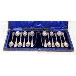 Set of 12 sterling silver teaspoons c/w a pair of tongs, hallmarked for Sheffield 1903. Offered in