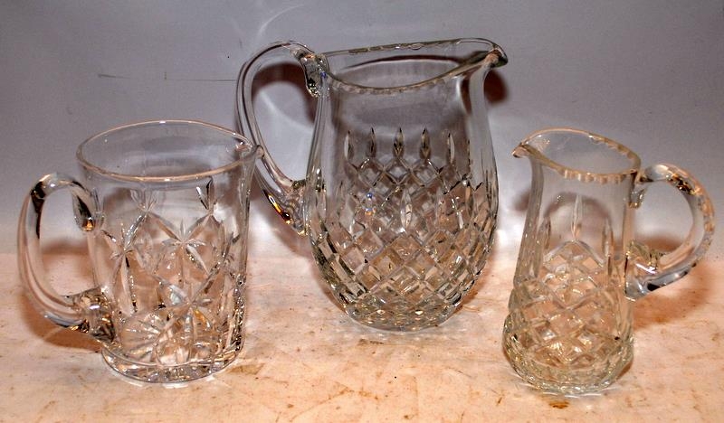 A collection of cut glass lead crystal jugs, the largest being 18cms tall. 8 in lot - Image 2 of 2