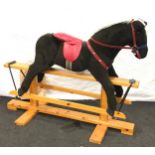 A large modern child's rocking horse.