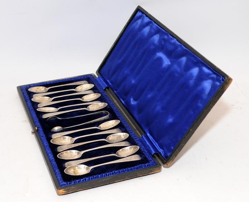 Set of 12 sterling silver teaspoons c/w a pair of tongs, hallmarked for Sheffield 1903. Offered in - Image 2 of 4