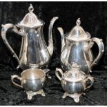 Matching silver plated tea and coffee pots with creamer and sugar bowl