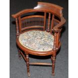 Edwardian Arts and Crafts occasiona tub chair with tapestry seat and original castors. Seat height