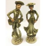 Pair of lady and gentleman porcelain figurines the largest measuring 34cm tall.