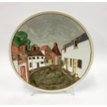 Poole Pottery interest large charger tube lined decorated depicting a street scene by Cynthia