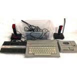 ATARI 65XE AND 2600. This comes also with an Atari XC12 tape unit and complete With joysticks and