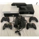 A BOX OF XBOX CONSOLES. To include 2 Xbox one’s and 2 Xbox 360’s. Comes with power leads and