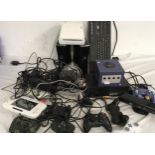 BOX OF GAMING CONSOLES. Large quantity of gaming consoles and controllers to include Xbox,