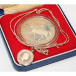 Sterling silver 1977 crown coin c/w a mounted 20 pence 1/10 Britannia on a silver chain