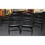 A set of six black Italian designer dining chairs.
